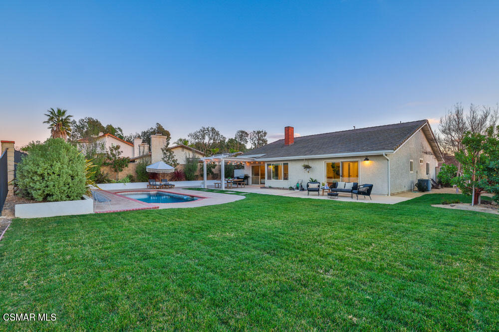 13777 Gunsmoke Road Moorpark, CA 93021 - Photo 35 of 42 a front view of house with yard and seating area