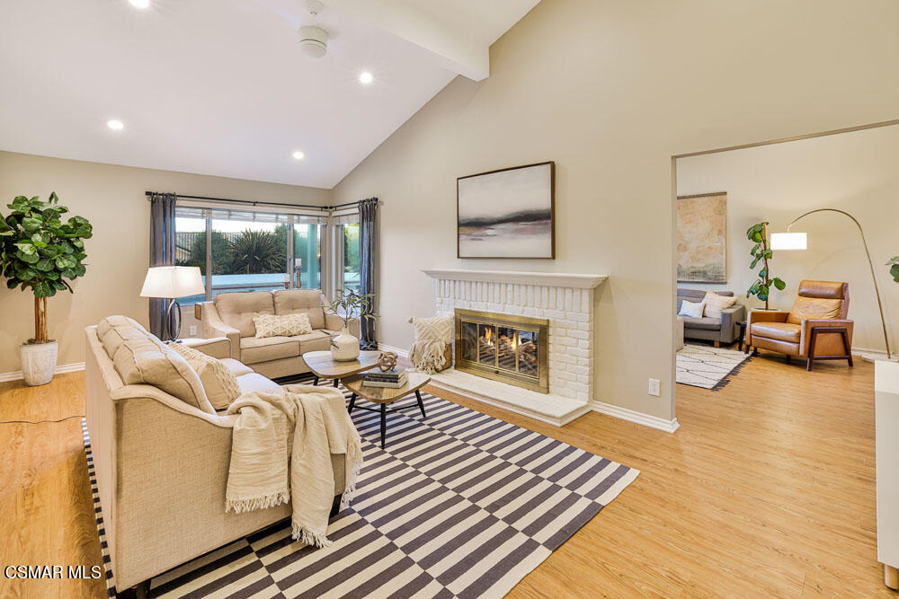13777 Gunsmoke Road Moorpark, CA 93021 - Photo 7 of 42 a living room with furniture fireplace and potted plant