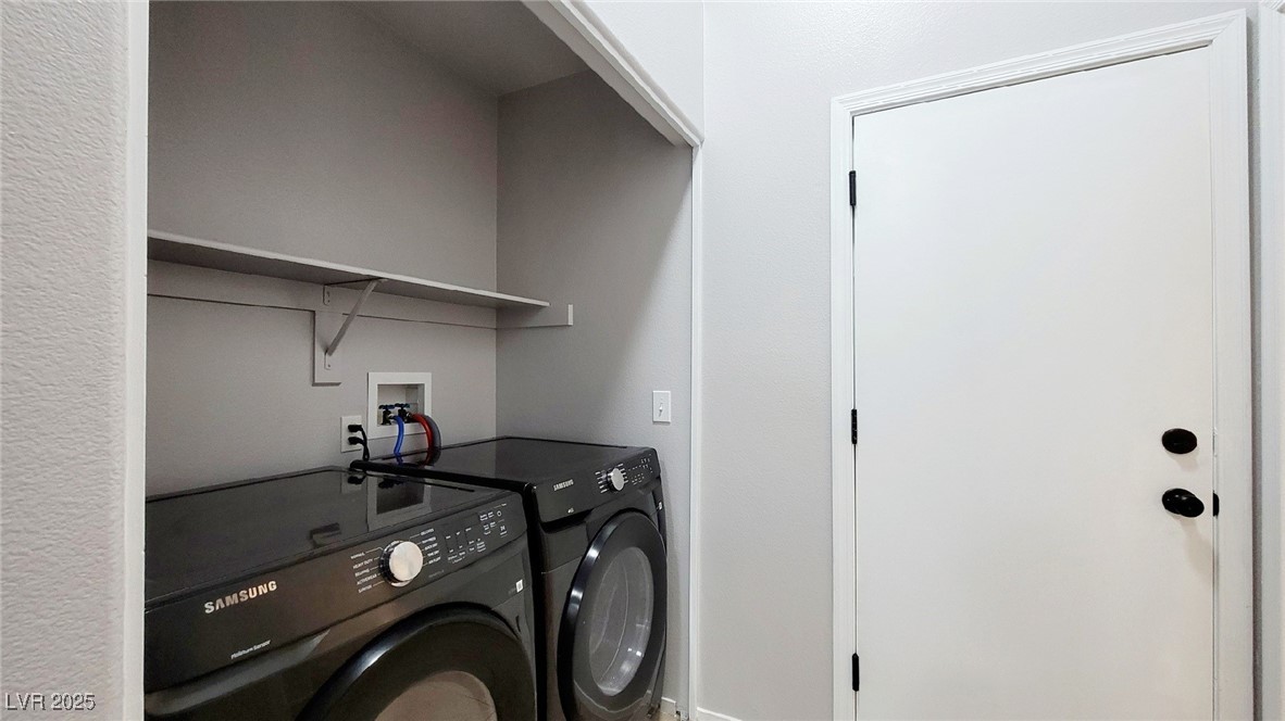 8840 Spinning Wheel Avenue Las Vegas, NV 89143 - Photo 18 of 24 Laundry area with independent washer and dryer and baseboards