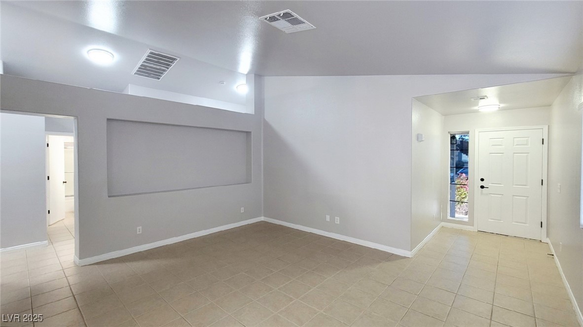 8840 Spinning Wheel Avenue Las Vegas, NV 89143 - Photo 5 of 24 Foyer entrance with light tile patterned floors