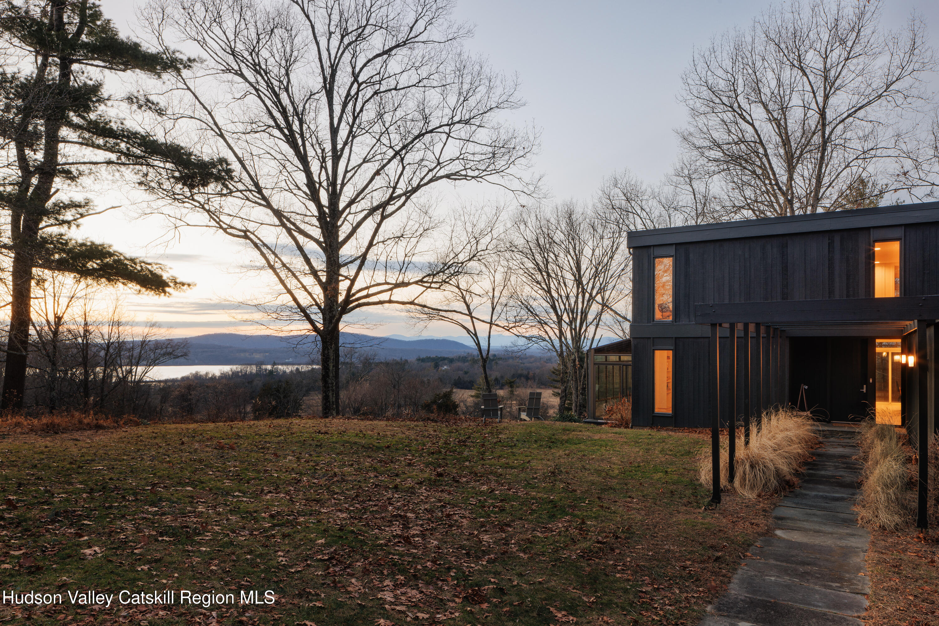 a view of house with yard