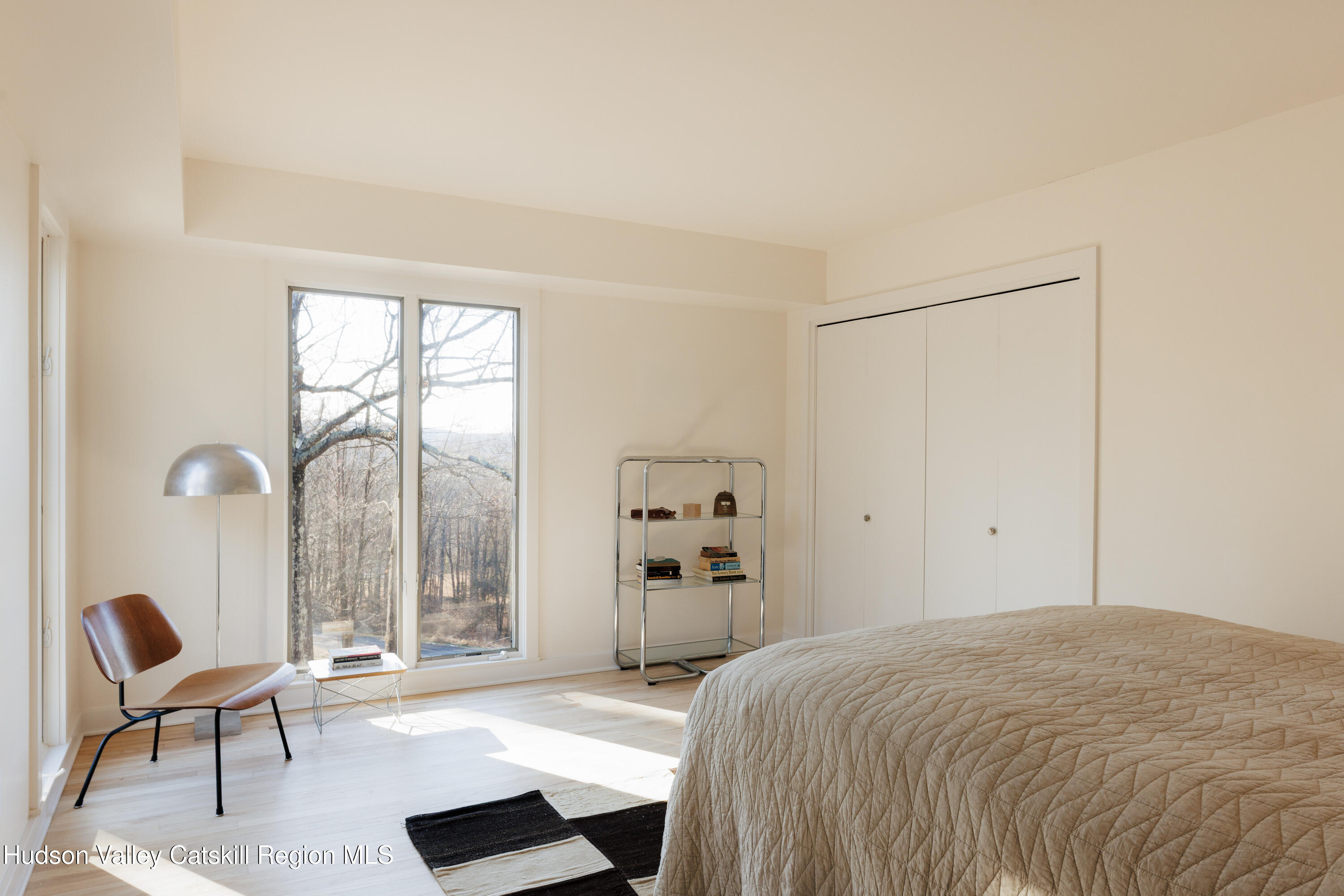110 Old Albany Post Road Rhinebeck, NY 12572 - Photo 22 of 46 a bedroom with a bed and a large window