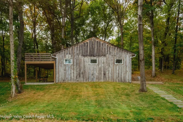 a backyard of a house with yard and tree