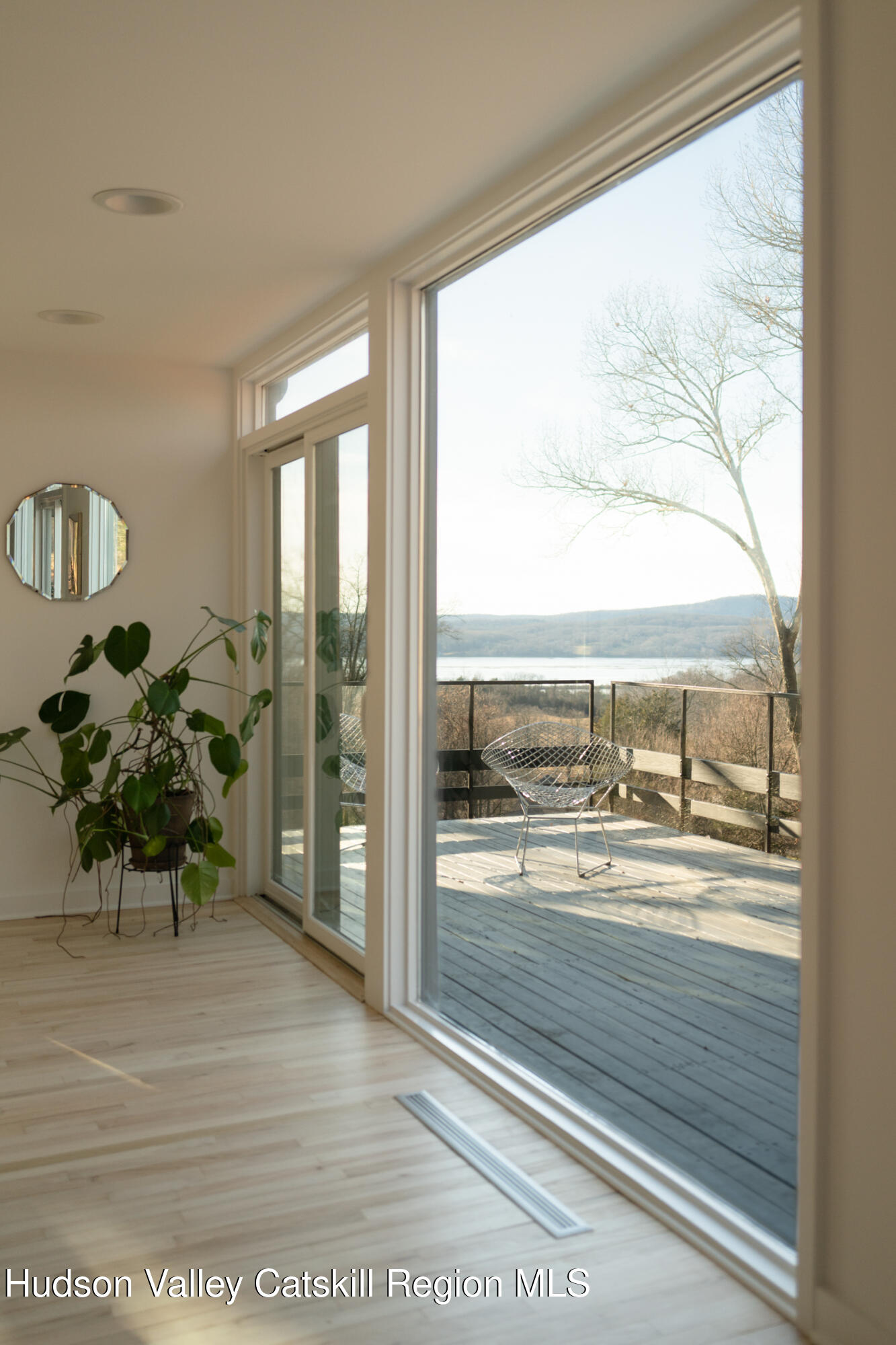 110 Old Albany Post Road Rhinebeck, NY 12572 - Photo 8 of 46 a view of a living room and a floor to ceiling window