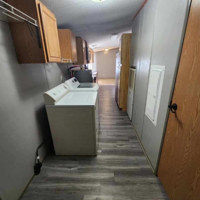 3595 Gainsville Road Mason, TN 38049 - Photo 16 of 28 a kitchen with a sink and a refrigerator