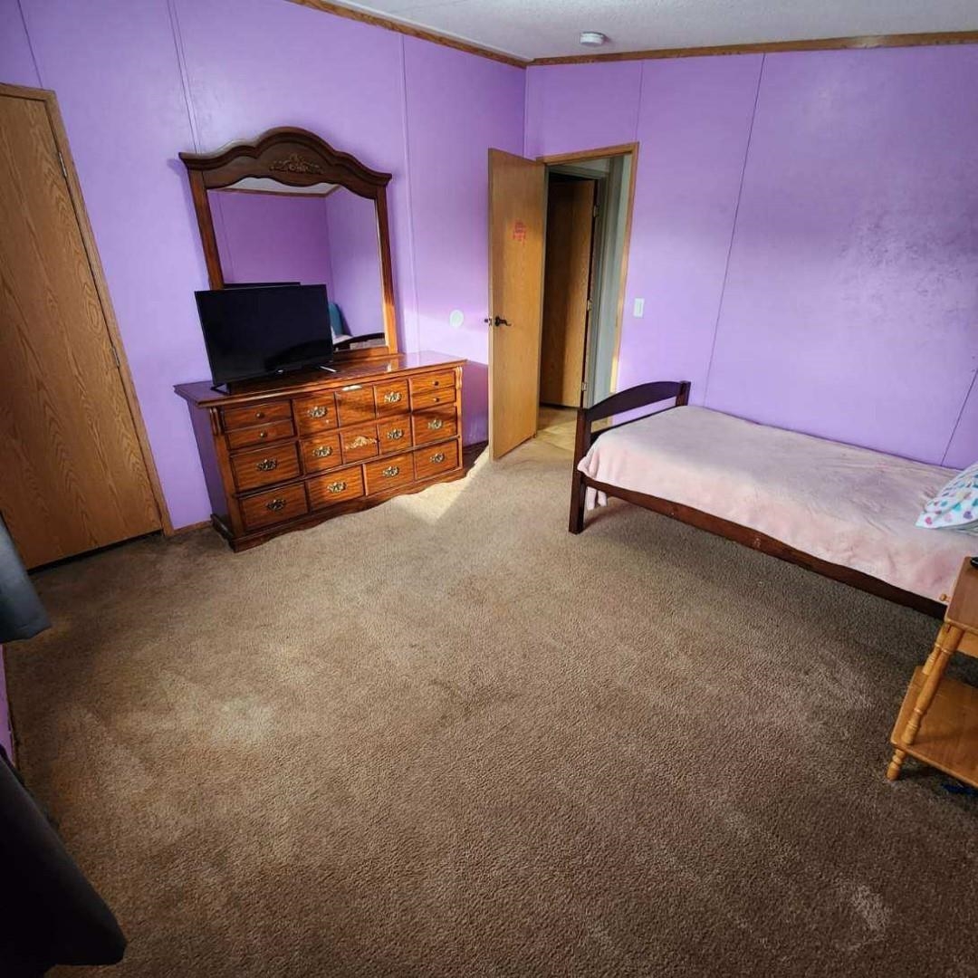 3595 Gainsville Road Mason, TN 38049 - Photo 25 of 28 a room with furniture and flat screen tv