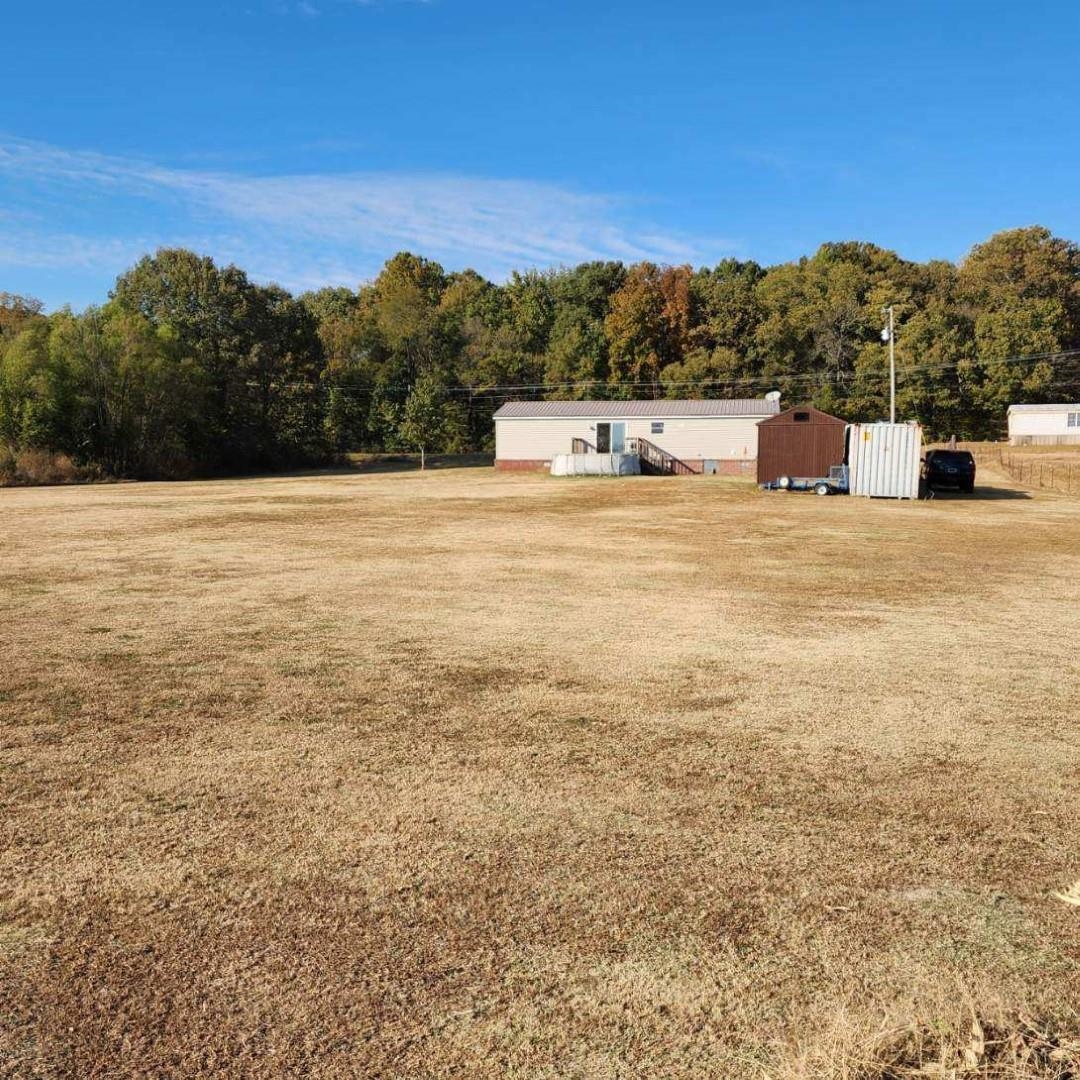 3595 Gainsville Road Mason, TN 38049 - Photo 9 of 28 a front view of a building with a yard