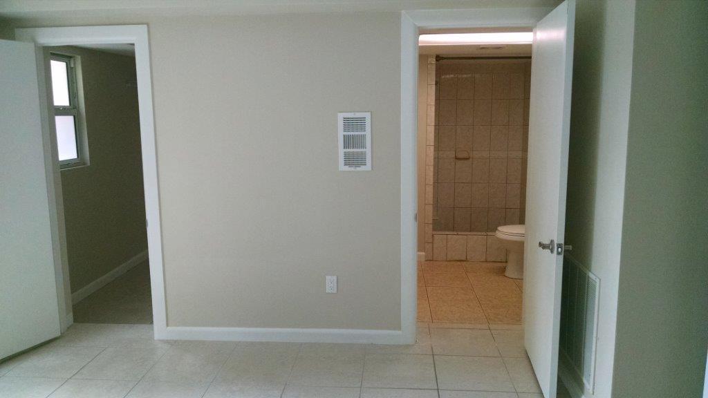 332 Cavalier Road Palm Springs, FL 33461 - Photo 8 of 16 view of a bathroom from a corridor