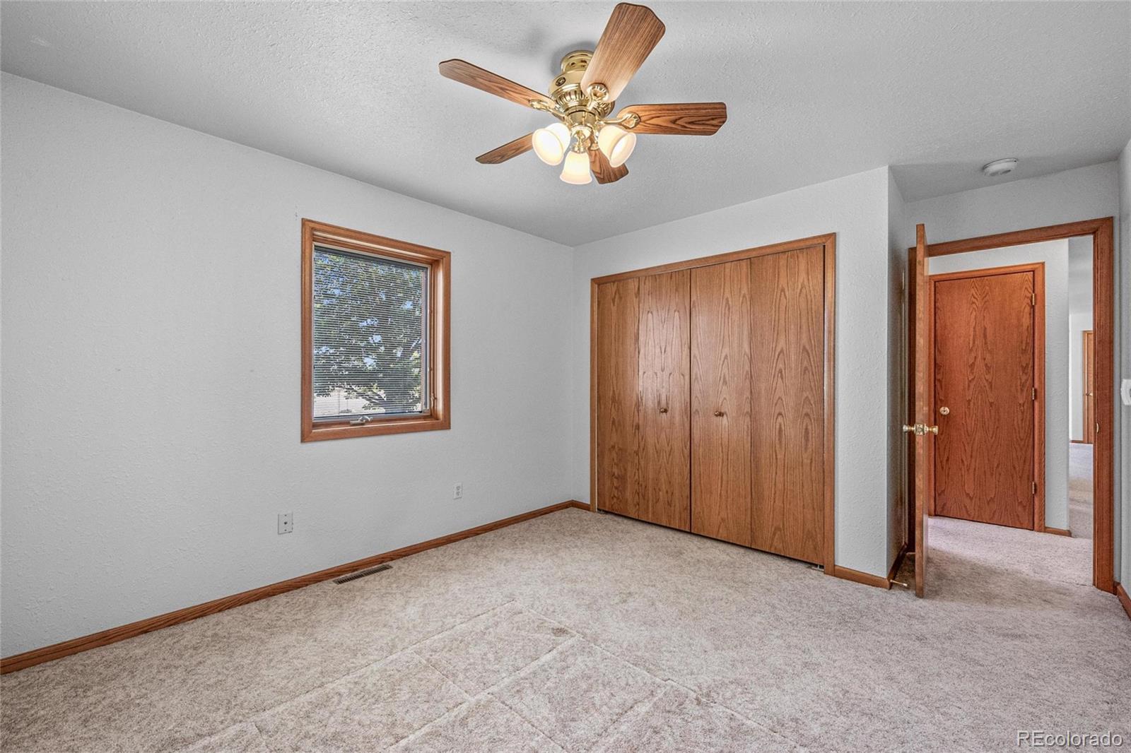 55 Cook Court Hudson, CO 80642 - Photo 22 of 50 a view of an empty room with a window