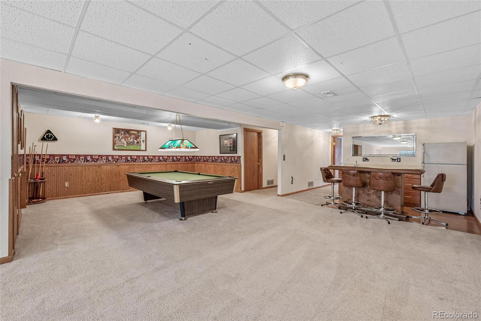 55 Cook Court Hudson, CO 80642 - Photo 28 of 50 a living room with furniture and a area