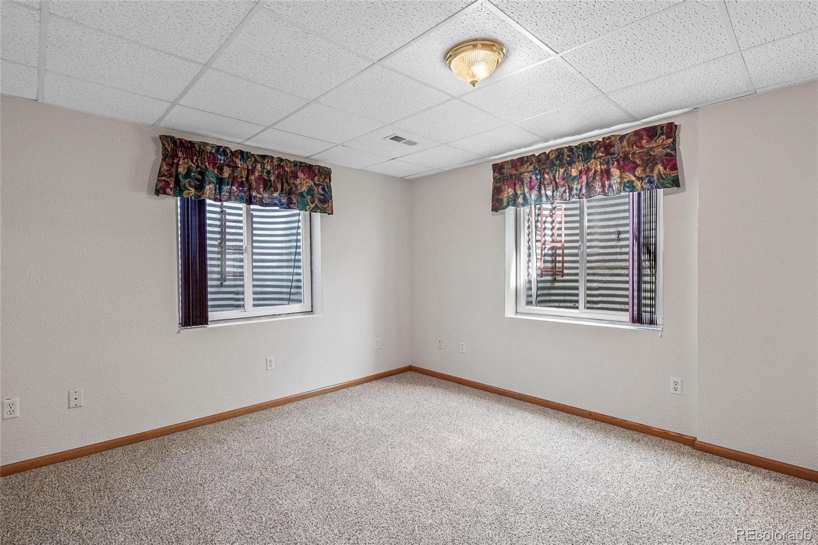 55 Cook Court Hudson, CO 80642 - Photo 32 of 50 an empty room with a window