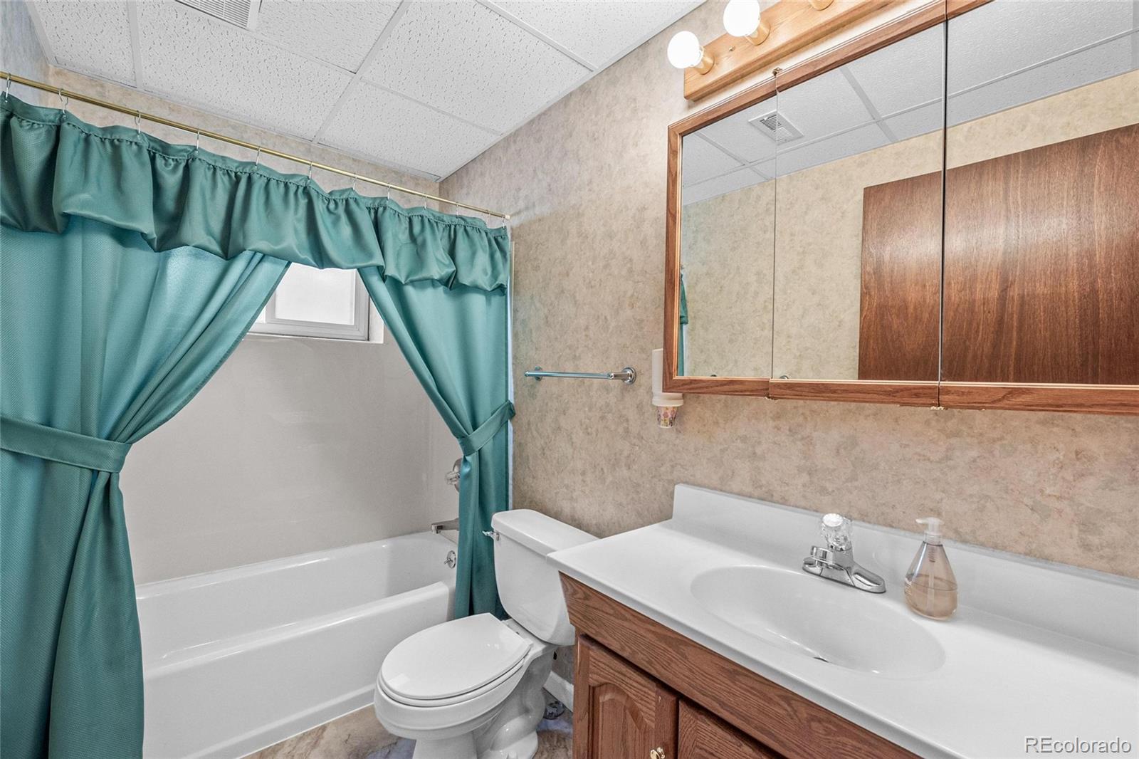 55 Cook Court Hudson, CO 80642 - Photo 34 of 50 a bathroom with a sink toilet and shower