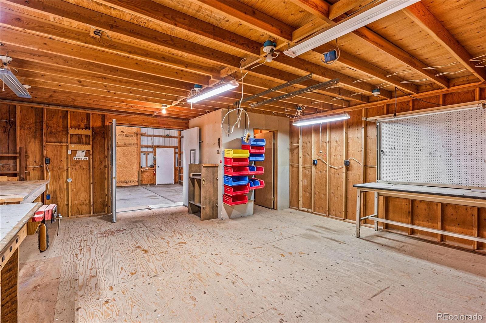 55 Cook Court Hudson, CO 80642 - Photo 41 of 50 a view of empty room with wooden ceiling
