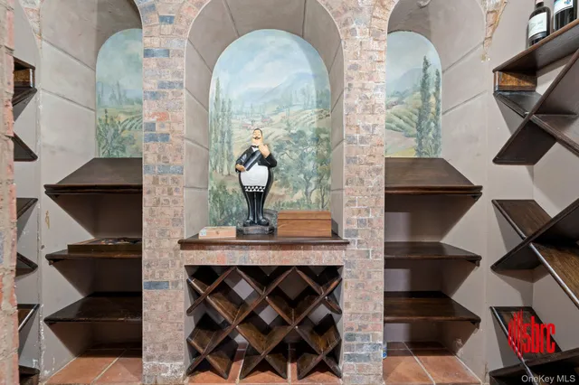 a dining table with chairs and kitchen view