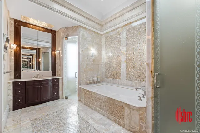 an aerial view of residential houses with outdoor space and parking