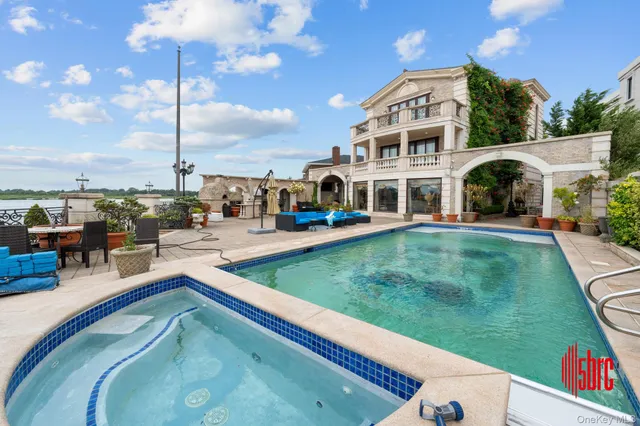 a view of a patio with dining table and chairs with a fire pit and a barbeque