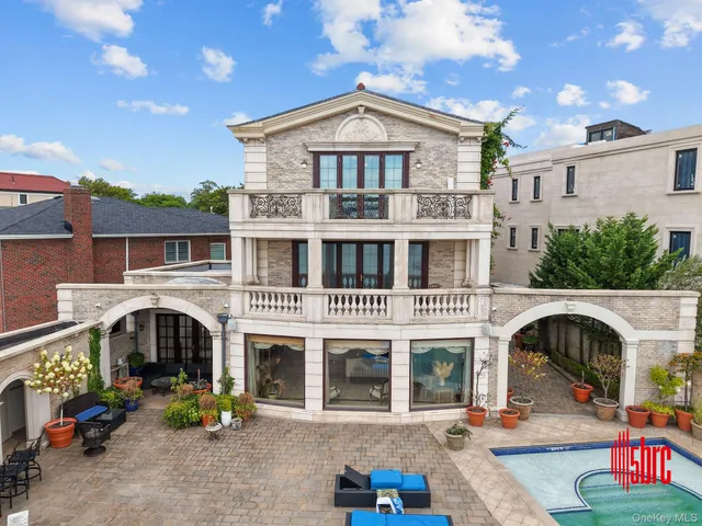 an aerial view of a house with outdoor space