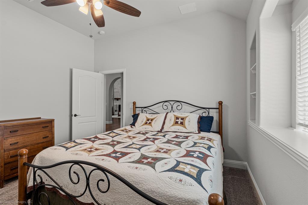 2139 Devonblue Drive Forney, TX 75126 - Photo 17 of 30 Secondary bedroom with built-in shelving and walk-in closet. Carpet