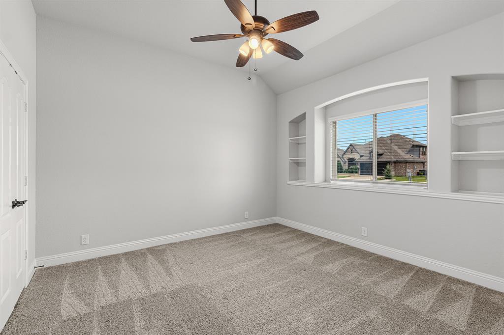 2139 Devonblue Drive Forney, TX 75126 - Photo 18 of 30 Secondary bedroom with built-in shelving and walk-in closet. Carpet