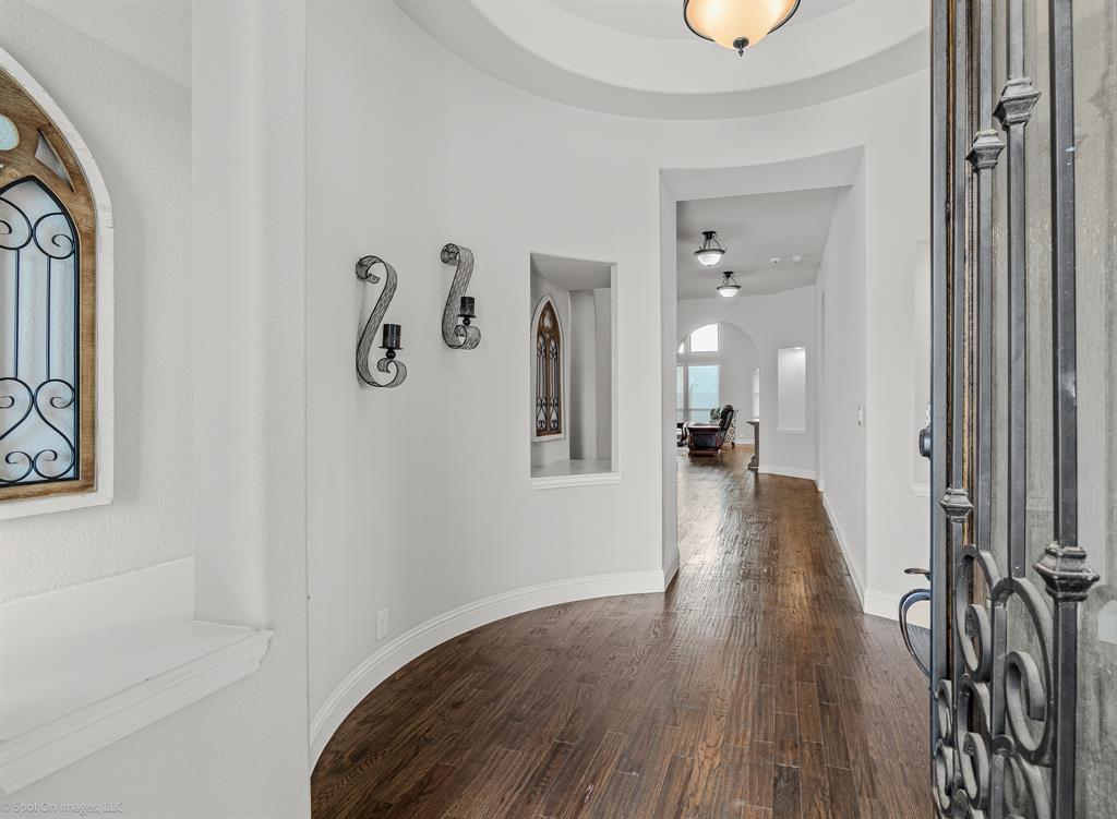 2139 Devonblue Drive Forney, TX 75126 - Photo 2 of 30 Entryway with decorative design, hand scraped wood floors.