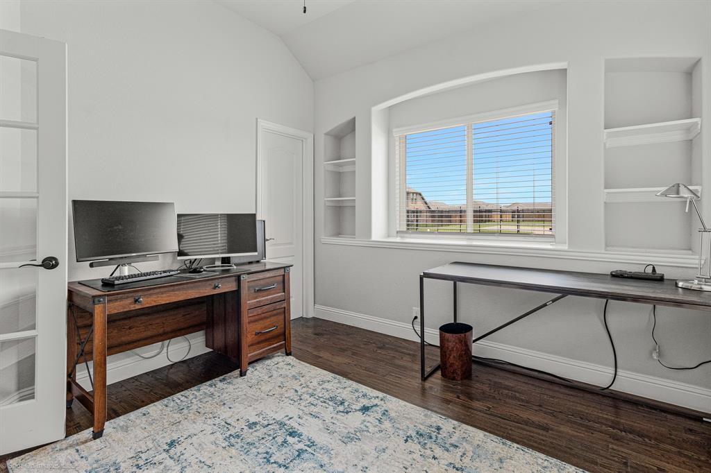 2139 Devonblue Drive Forney, TX 75126 - Photo 21 of 30 Bedroom (or office) with built in features, hand-scraped wood floors, walk-in closed and french door.