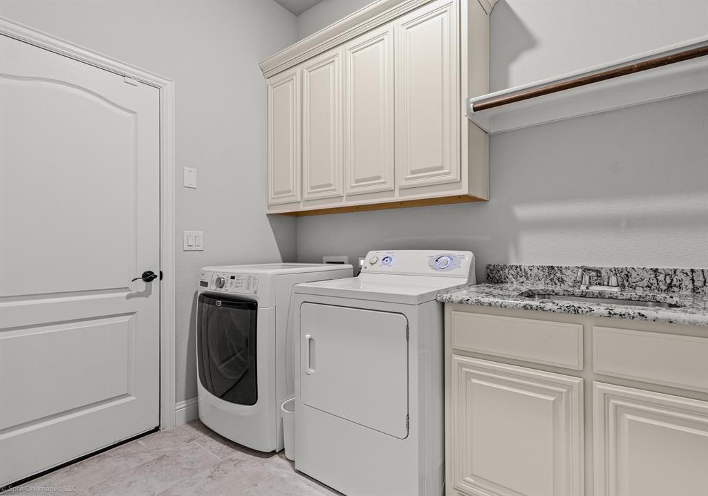2139 Devonblue Drive Forney, TX 75126 - Photo 24 of 30 Laundry room with sink and tons of cabinet space! Enter from garage or from the attached mud room.