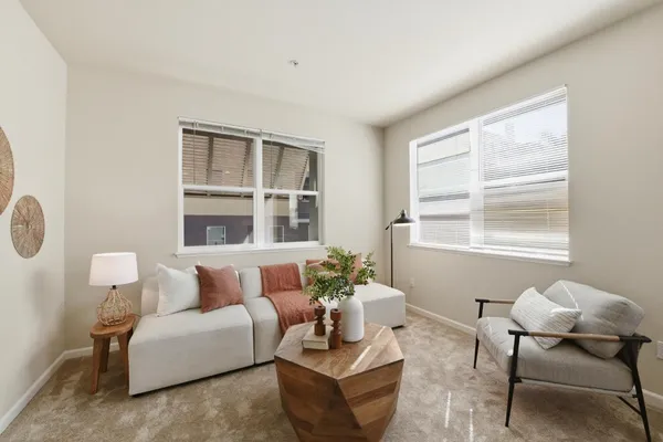 a living room with furniture and a window