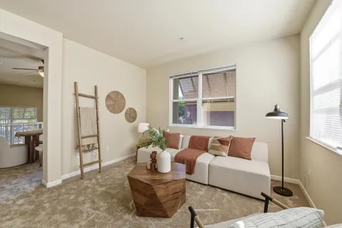 a living room with furniture and a window