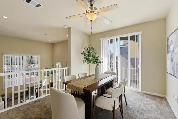a view of a dining room with furniture window and wooden floor