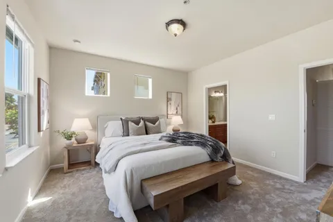 a bedroom with bed and window