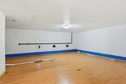 a view of an empty room with projector