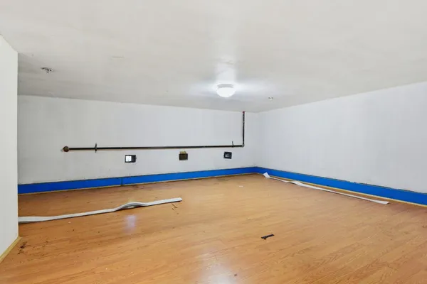 a view of an empty room with projector