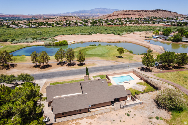 1470 Redwood Tree Street St. George, UT 84790 - Photo 3 of 53 Property featuring a private swimming pool, mature landscaping, and a golf course frontage