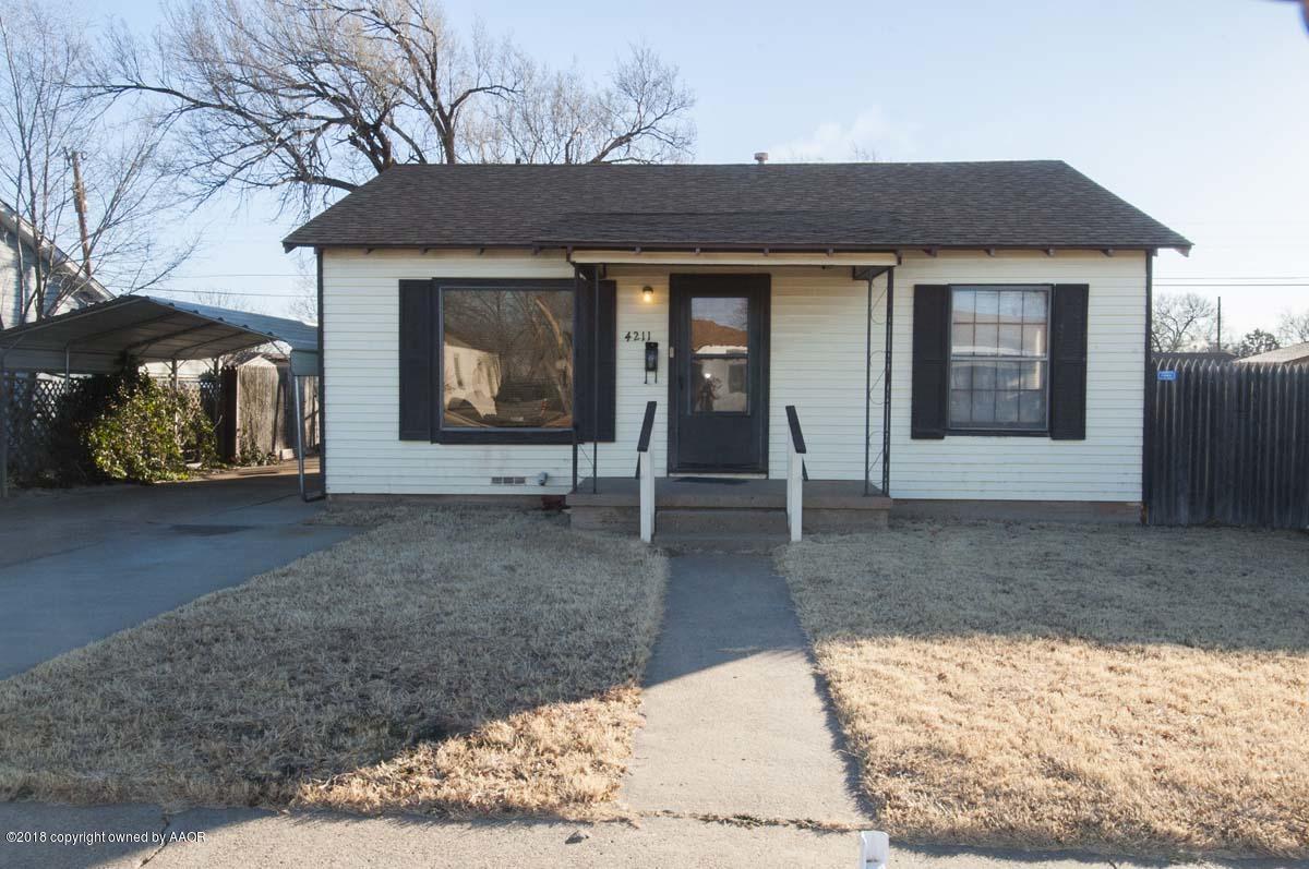 4211 South Harrison Street Amarillo, TX 79110 - Photo 1 of 22 a front view of a house with garden