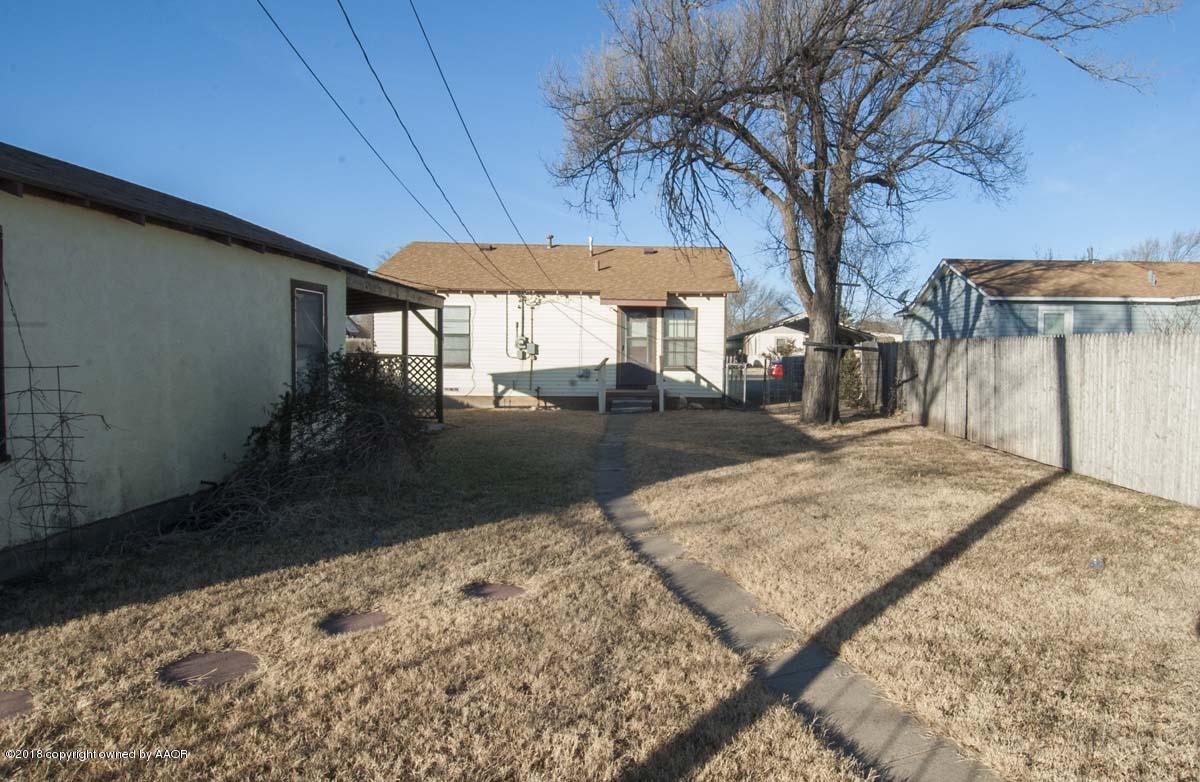 4211 South Harrison Street Amarillo, TX 79110 - Photo 20 of 22 a view of a backyard with a large tree