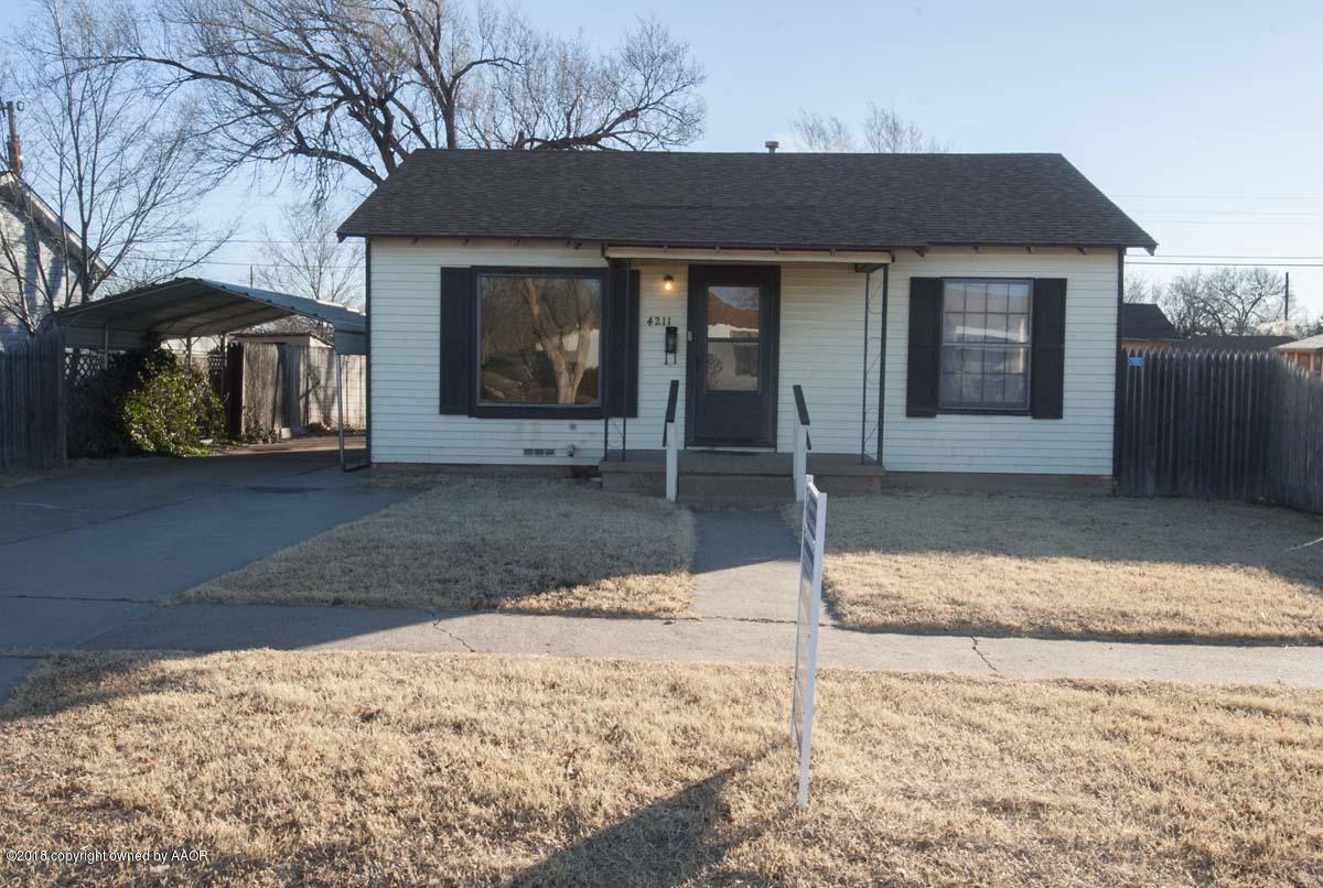 4211 South Harrison Street Amarillo, TX 79110 - Photo 22 of 22 a front view of a house with a yard