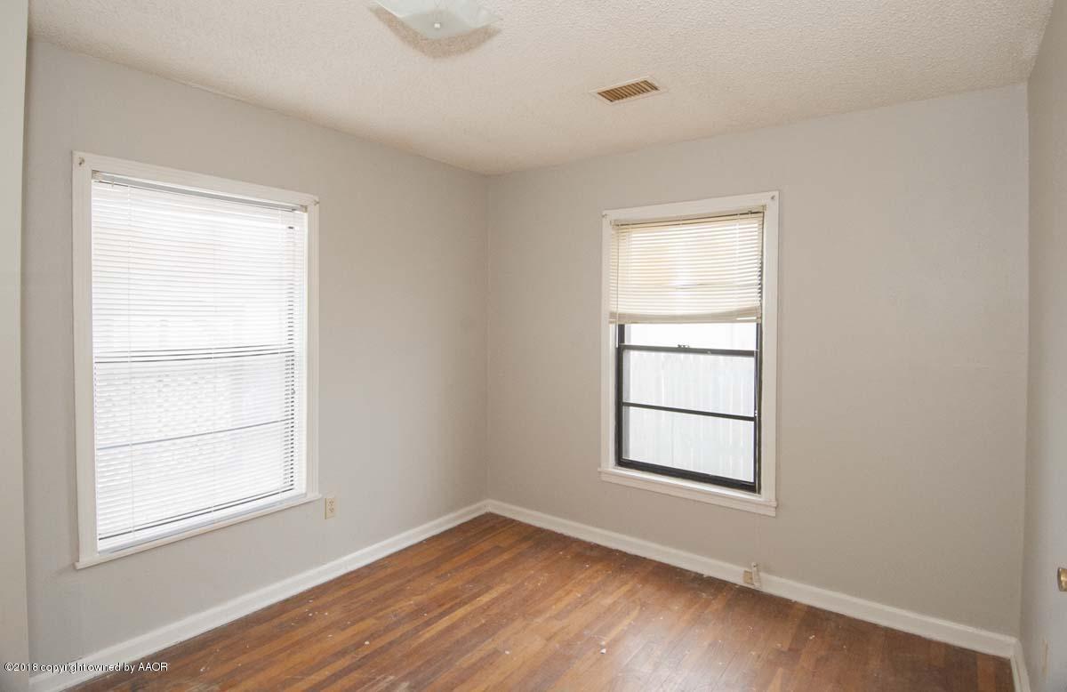 4211 South Harrison Street Amarillo, TX 79110 - Photo 6 of 22 an empty room with a window
