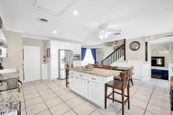 a kitchen with appliances cabinets and a window