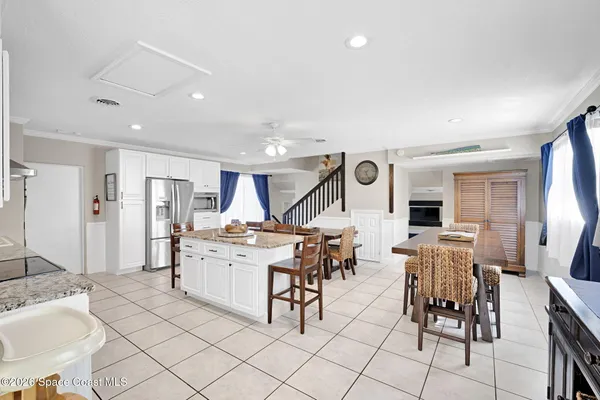 a kitchen with a table and chairs in it