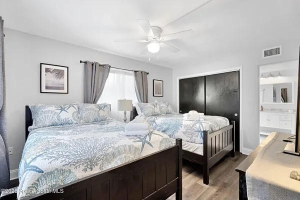 a bedroom with a bed a table and chair