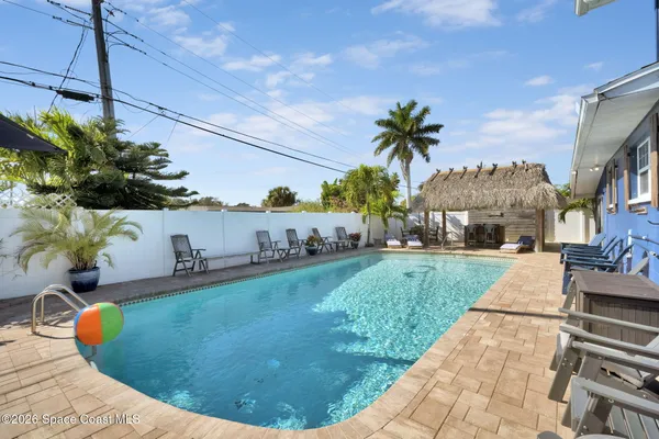 a view of a swimming pool with a patio