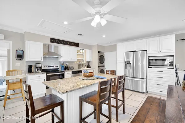 a view of kitchen with furniture and window