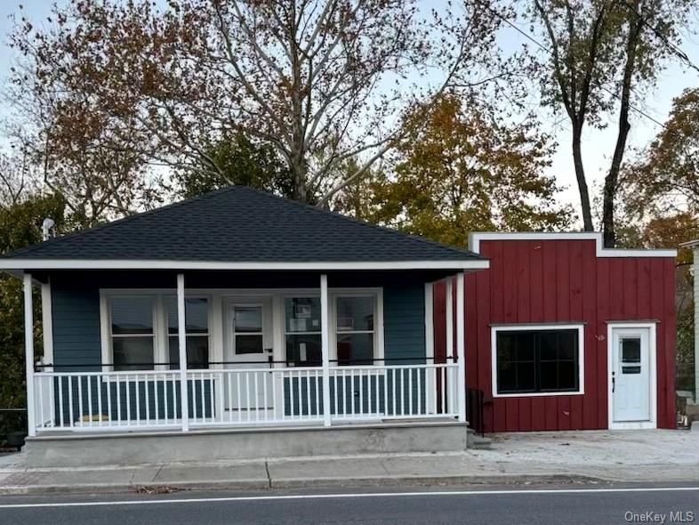 32 Western Avenue, Unit SUITE 3 Marlboro, NY 12542 - Photo 1 of 10 View of front of house with covered porch, a shingled roof, and board and batten siding