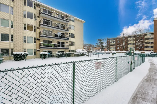 a view of building with cars
