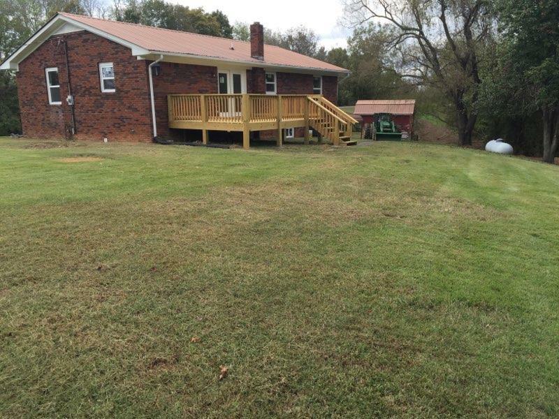 8074 Clemons Ridge Road Silver Point, TN 38582 - Photo 3 of 26 a front view of a house with a garden and trees