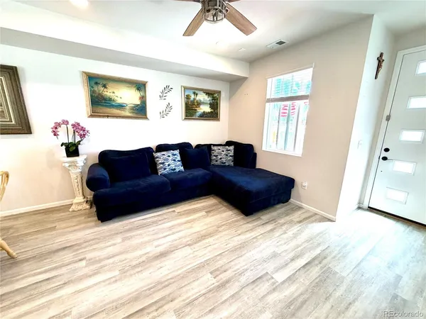 a living room with a couch and a window