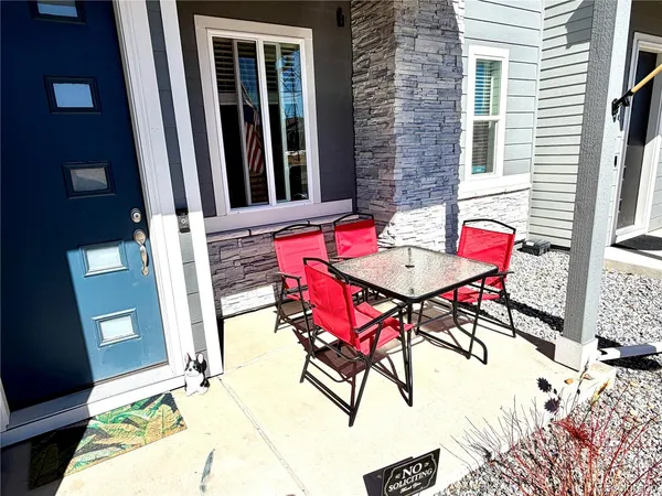 a view of a dining room with furniture and rug floor
