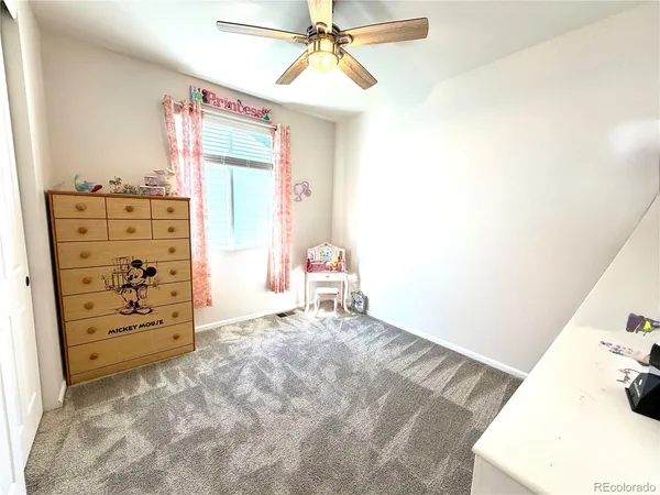 a view of a bedroom with closet and cabinet
