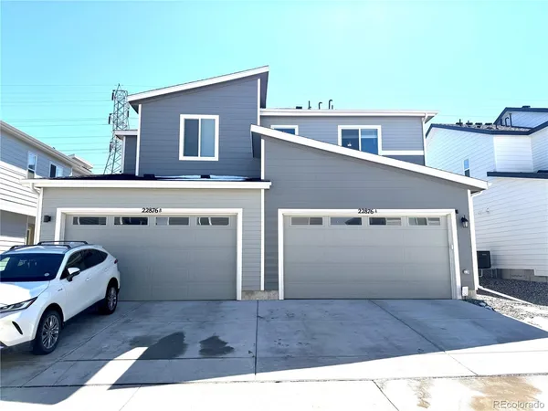 a view of a house with a barbeque