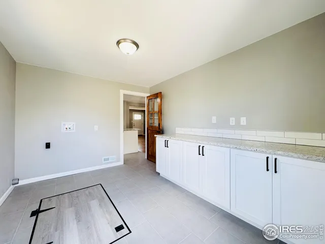 a view of a livingroom with wooden floor